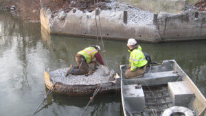 Herberger crews work on the demolition of an Ottumwa bridge.