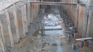 Muddy water sits at the bottom of support infrastructure on Grand Avenue.